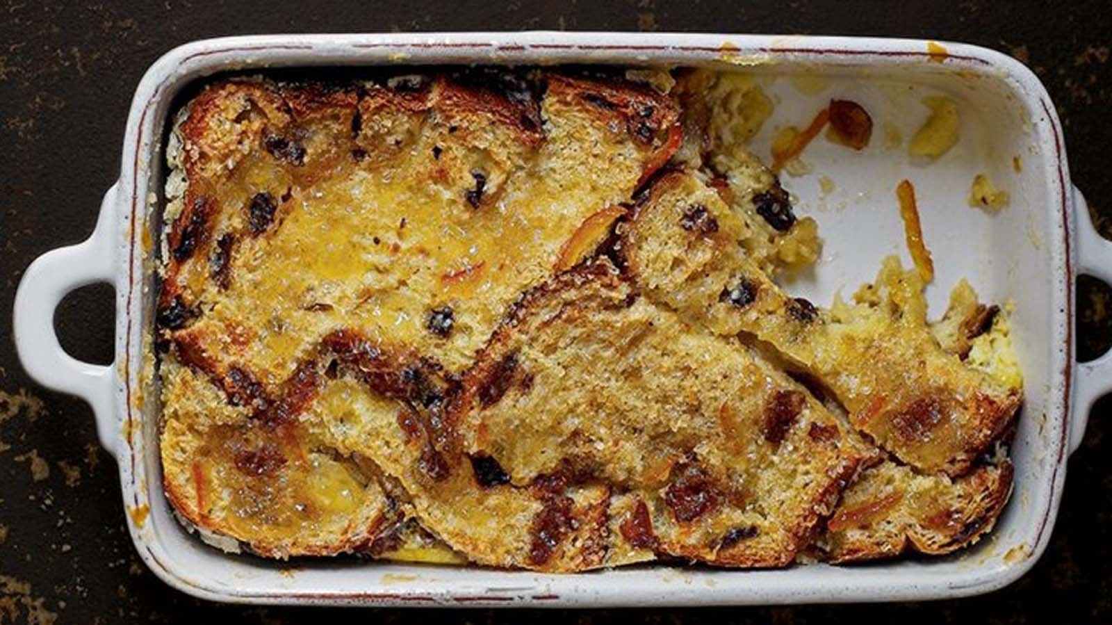 A traditional baked golden brown bread and butter pudding fresh from the oven.