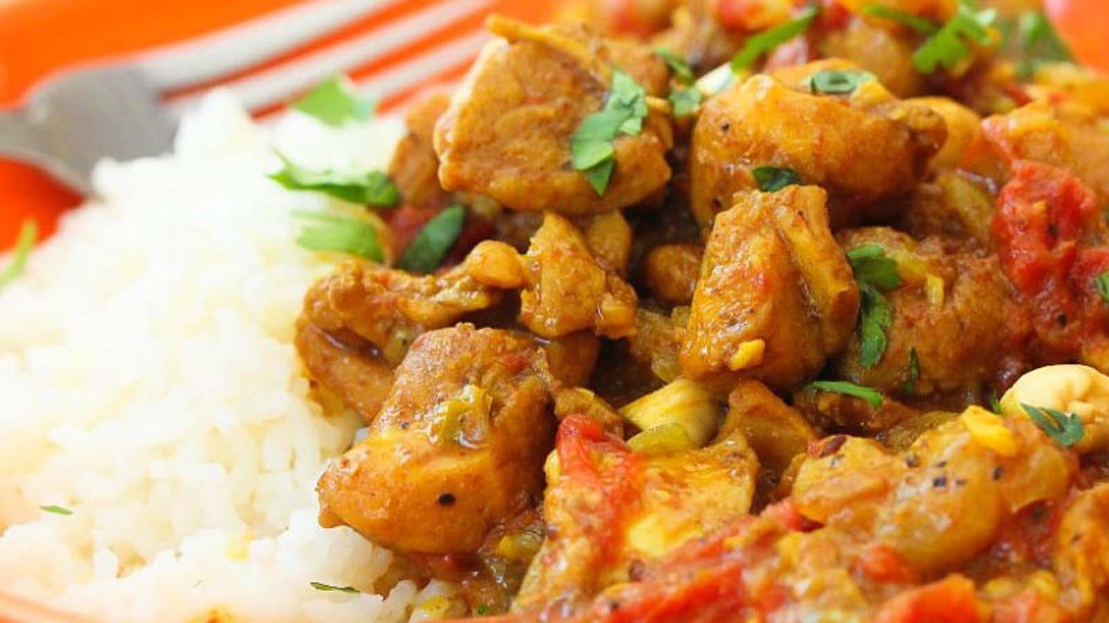A fragrant, aromatic golden chicken curry simmering with deep spices.