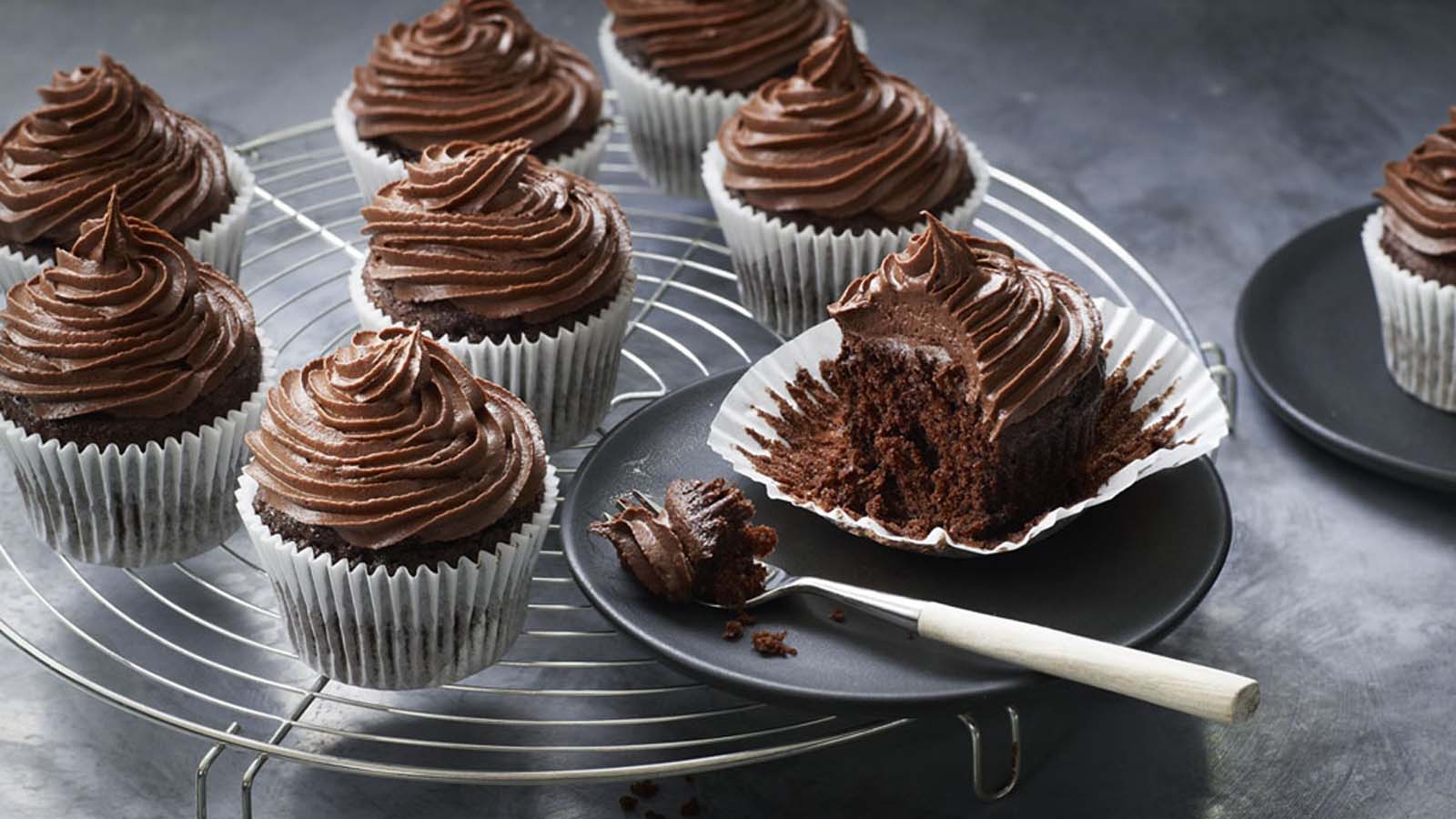 Decadent chocolate cupcakes topped with a swirl of rich chocolate buttercream frosting.