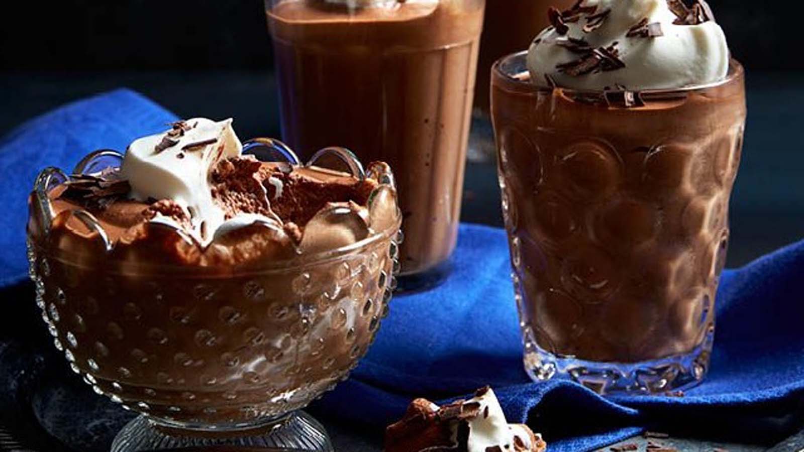 Light and airy chocolate mousse served in elegant glass cups topped with chocolate shavings.