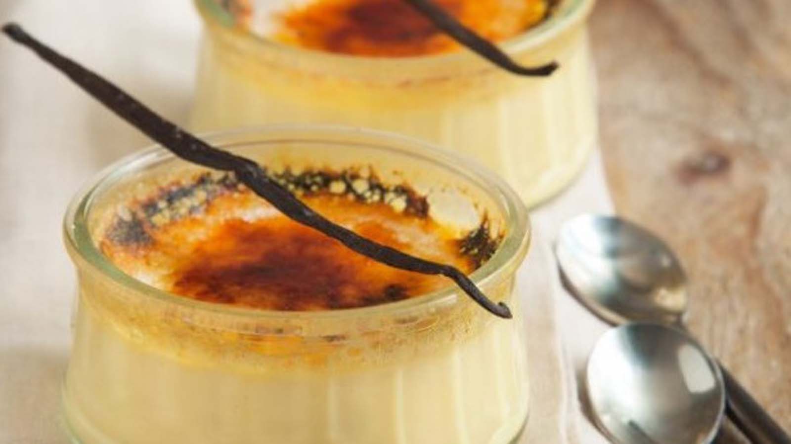 A smooth creme brulee dessert with a perfectly caramelised, brittle sugar crust on top.