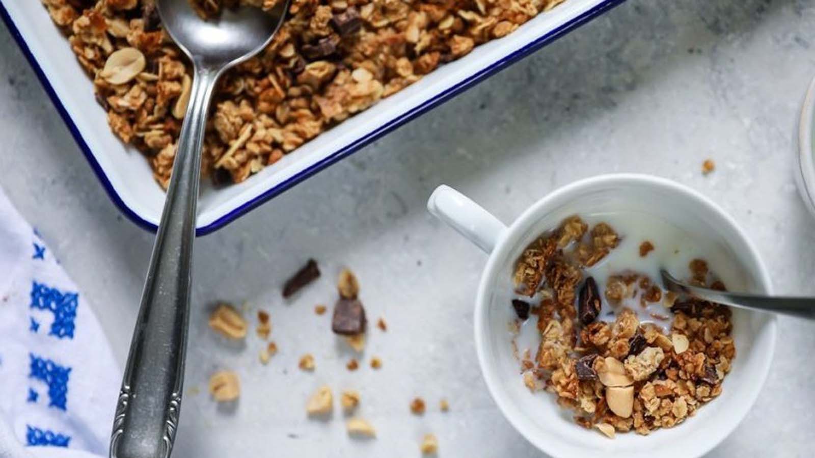 A healthy bowl of toasted breakfast muesli with nuts, seeds, and rolled oats.
