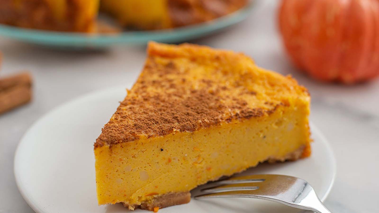 A traditional baked South African sweet pumpkin tart with a spiced cinnamon aroma.