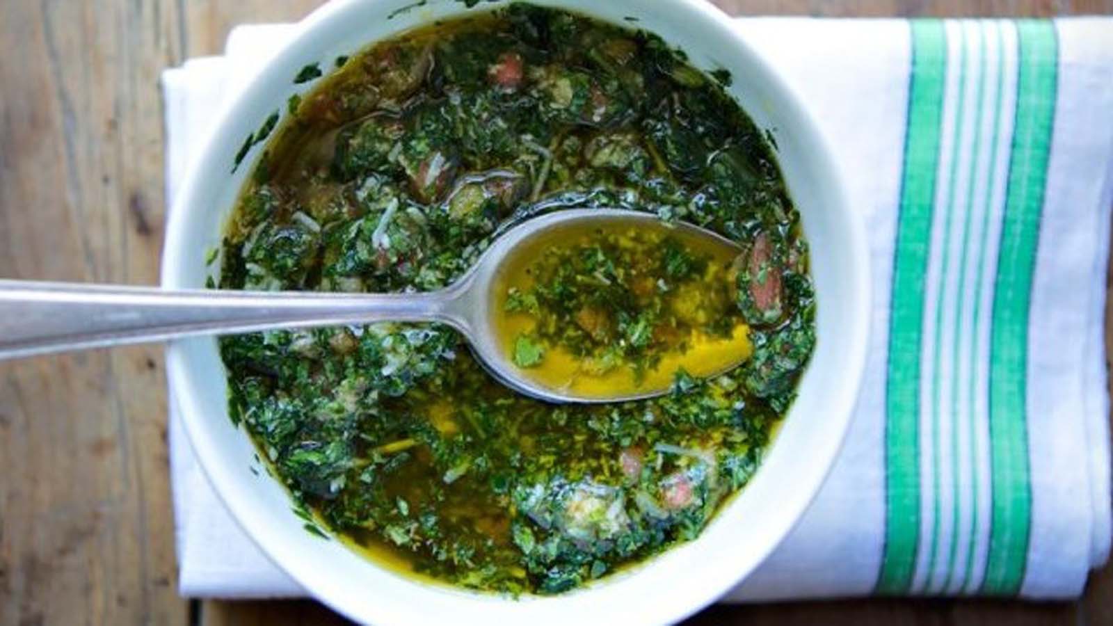 A bright green, fresh Italian salsa verde herb sauce with parsley and capers.