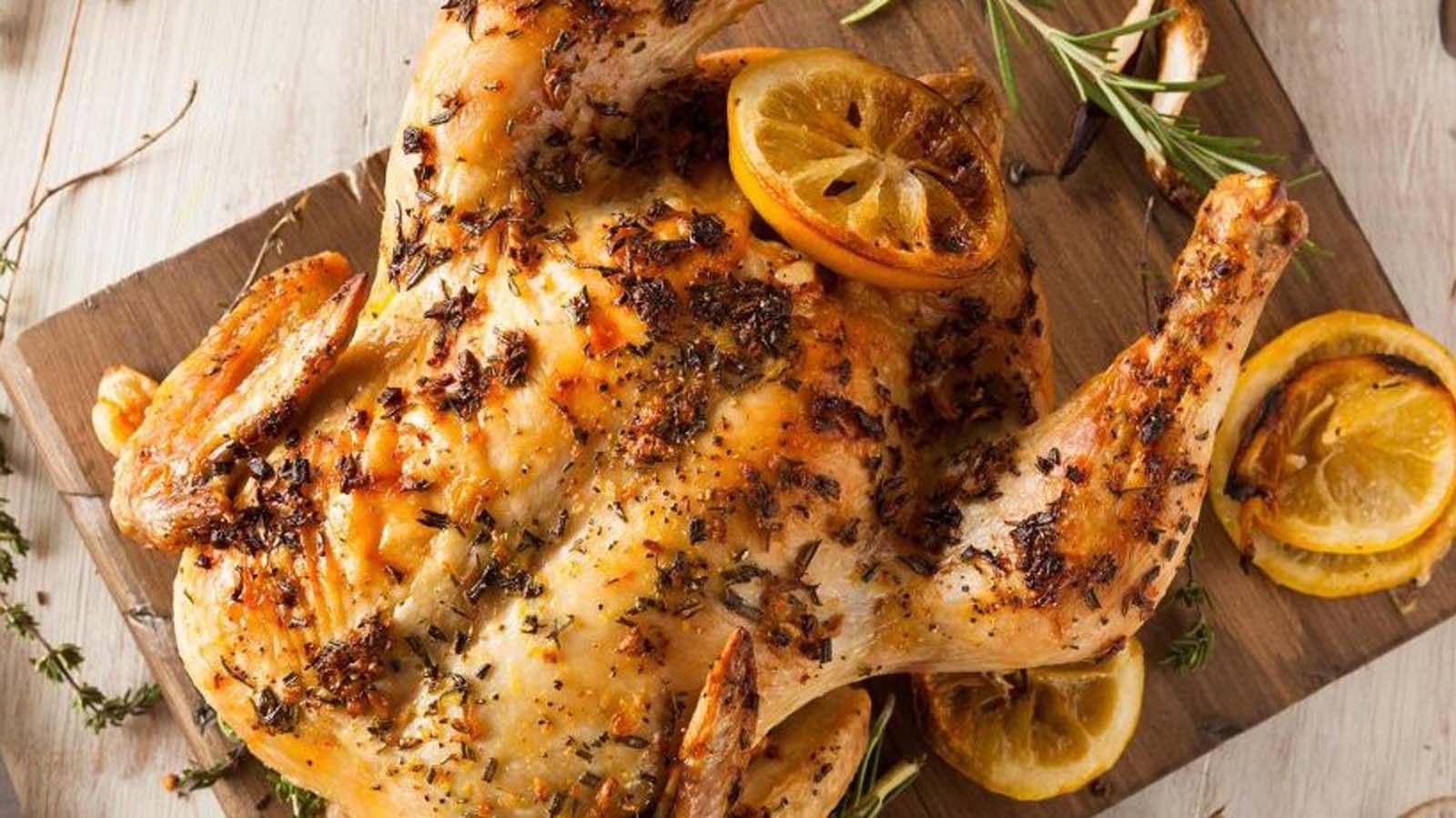 A perfectly golden traditional roast chicken served on a holiday platter.