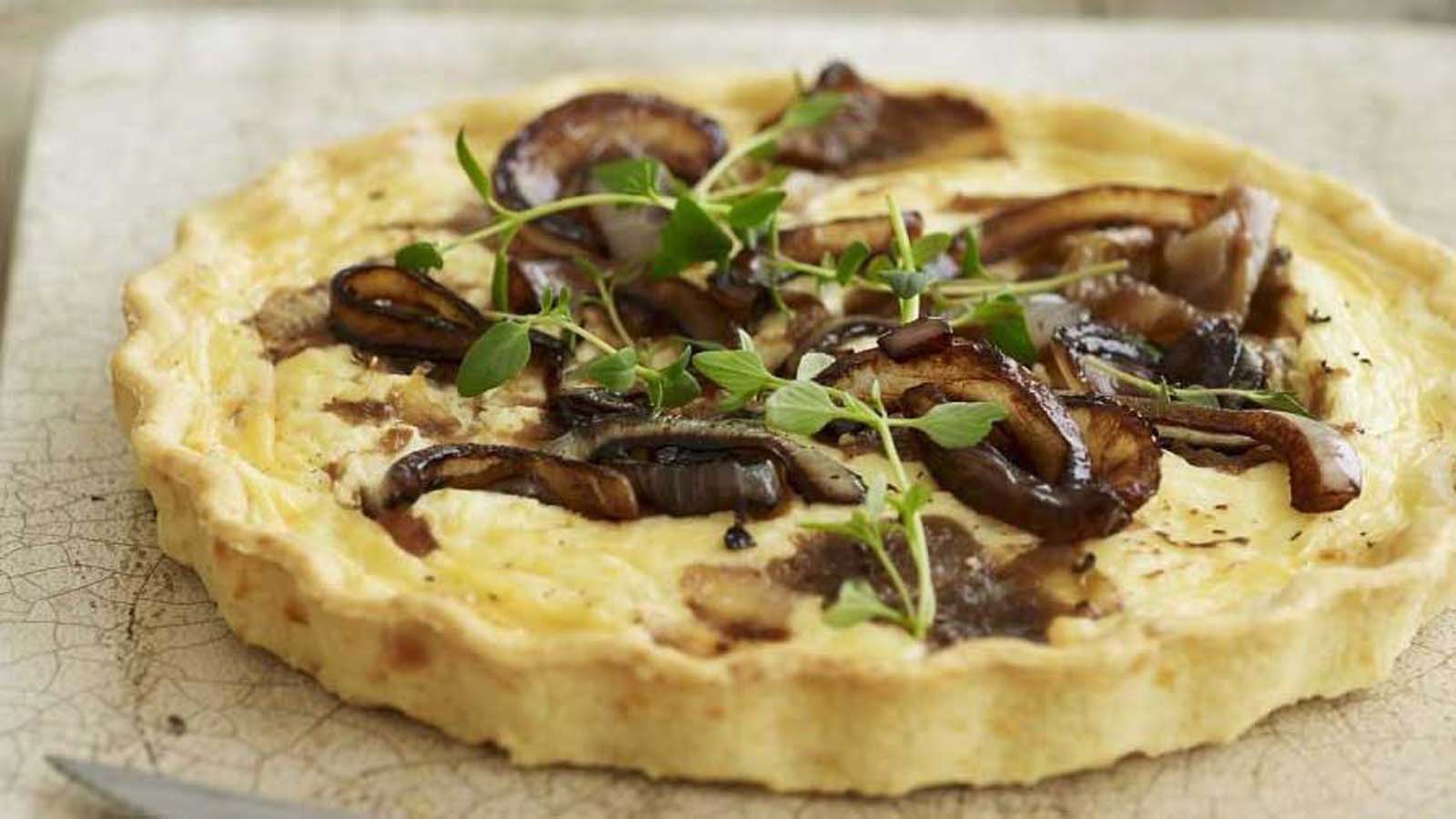A savoury baked quiche loaded with smoky bacon pieces and sweet red onion marmalade.