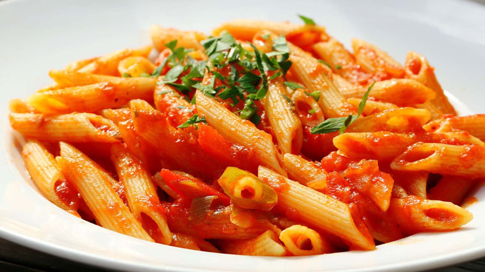 Tossed pasta with tender butternut pieces, crispy bacon, and a savoury tomato sauce.