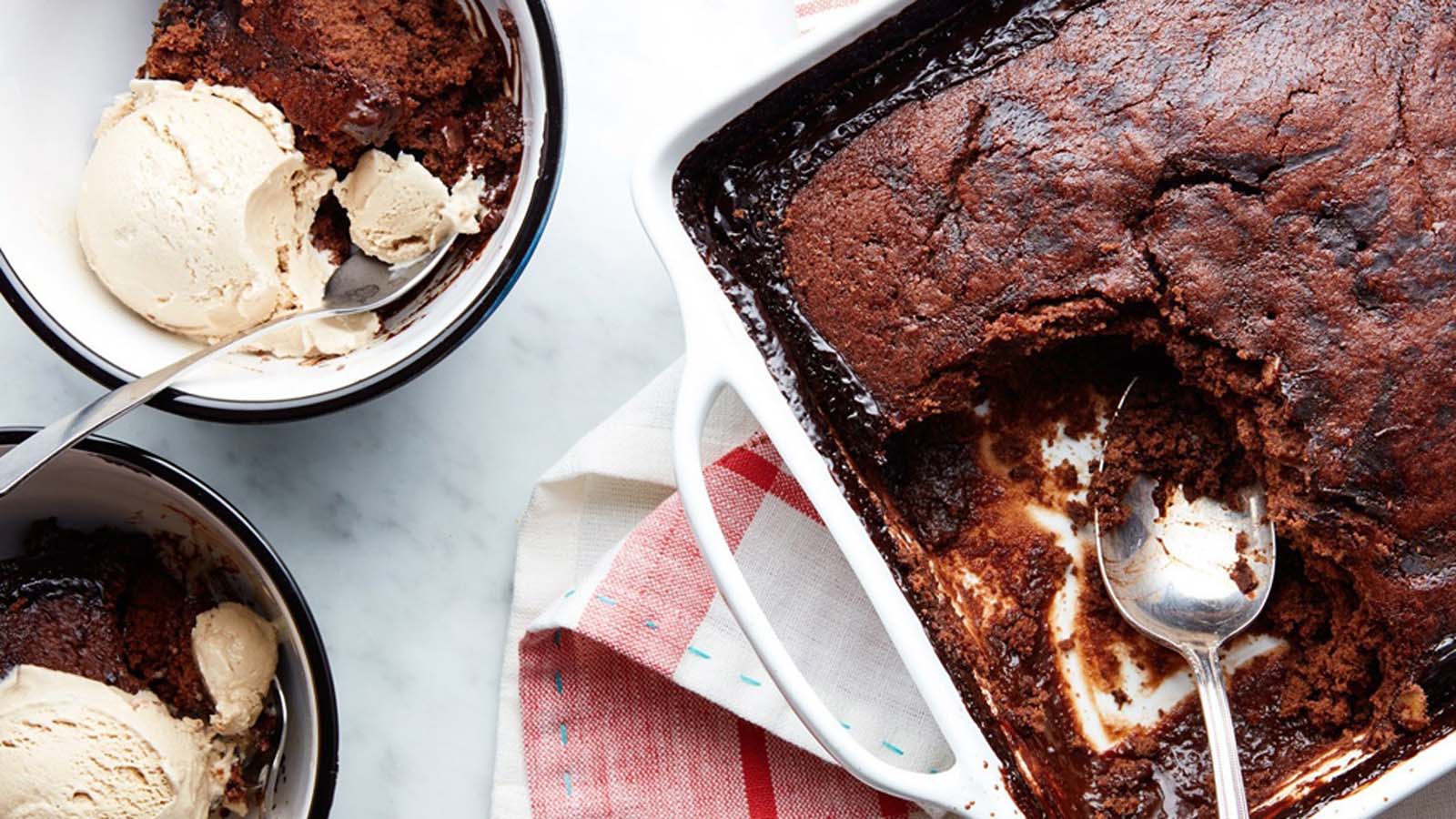 A warm baked chocolate pudding dessert dripping with hot chocolate fudge sauce.