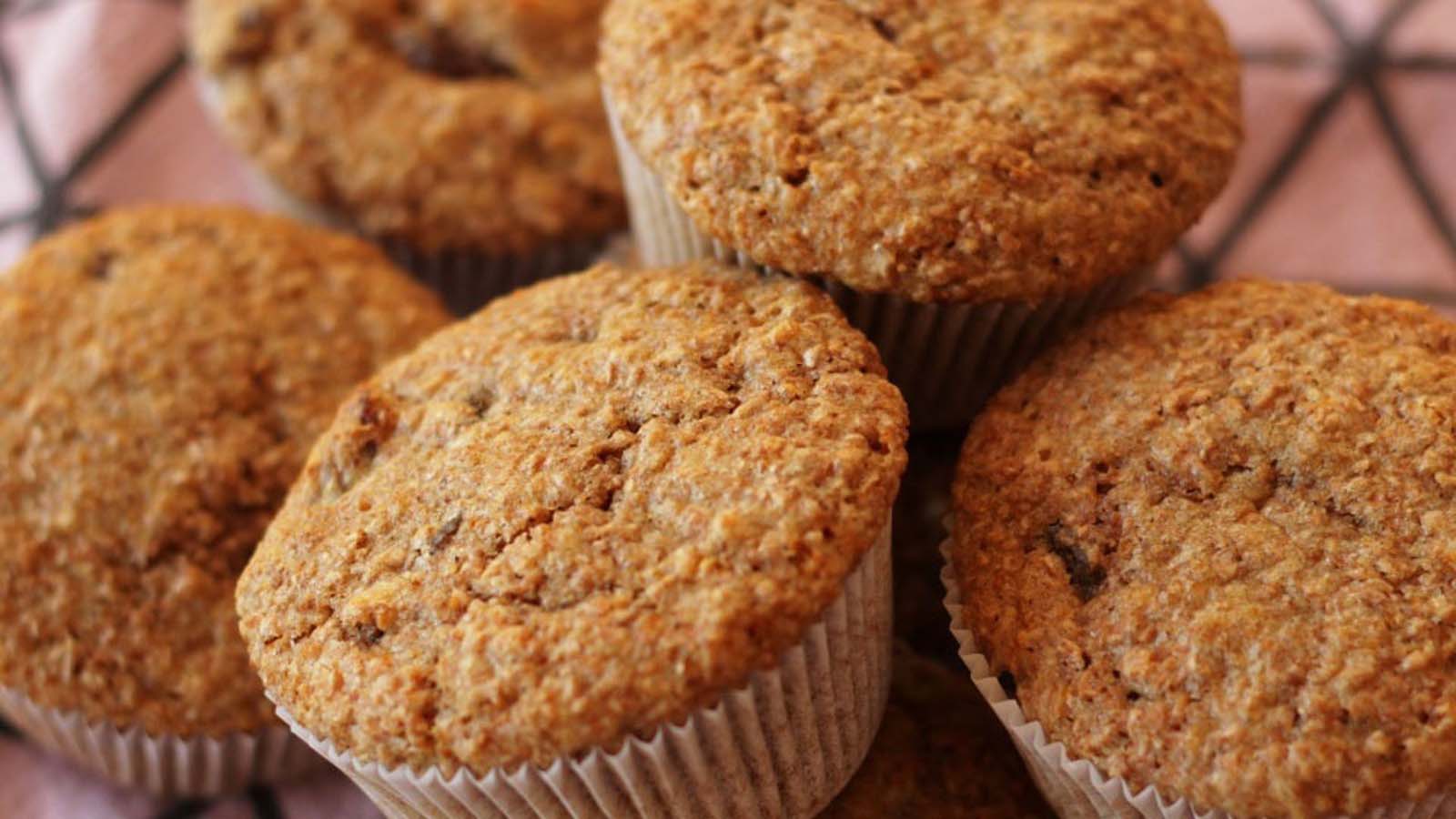 Healthy fiber-rich baked bran muffins packed with sweet raisins and chopped sweet dates.