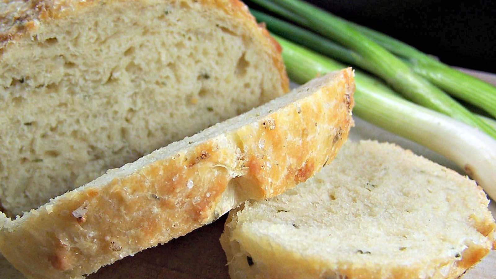 A savoury loaf of quick bread filled with melted cheese, fresh chives, and onions.