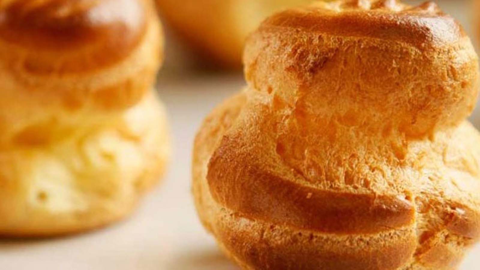 Light, hollow and crisp freshly baked choux pastry shells for profiteroles.