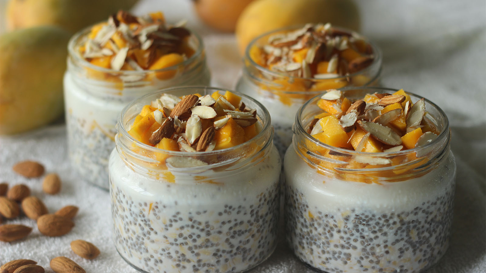A warm breakfast bowl of creamy oatmeal oats drizzled with honey and raw fresh fruits.