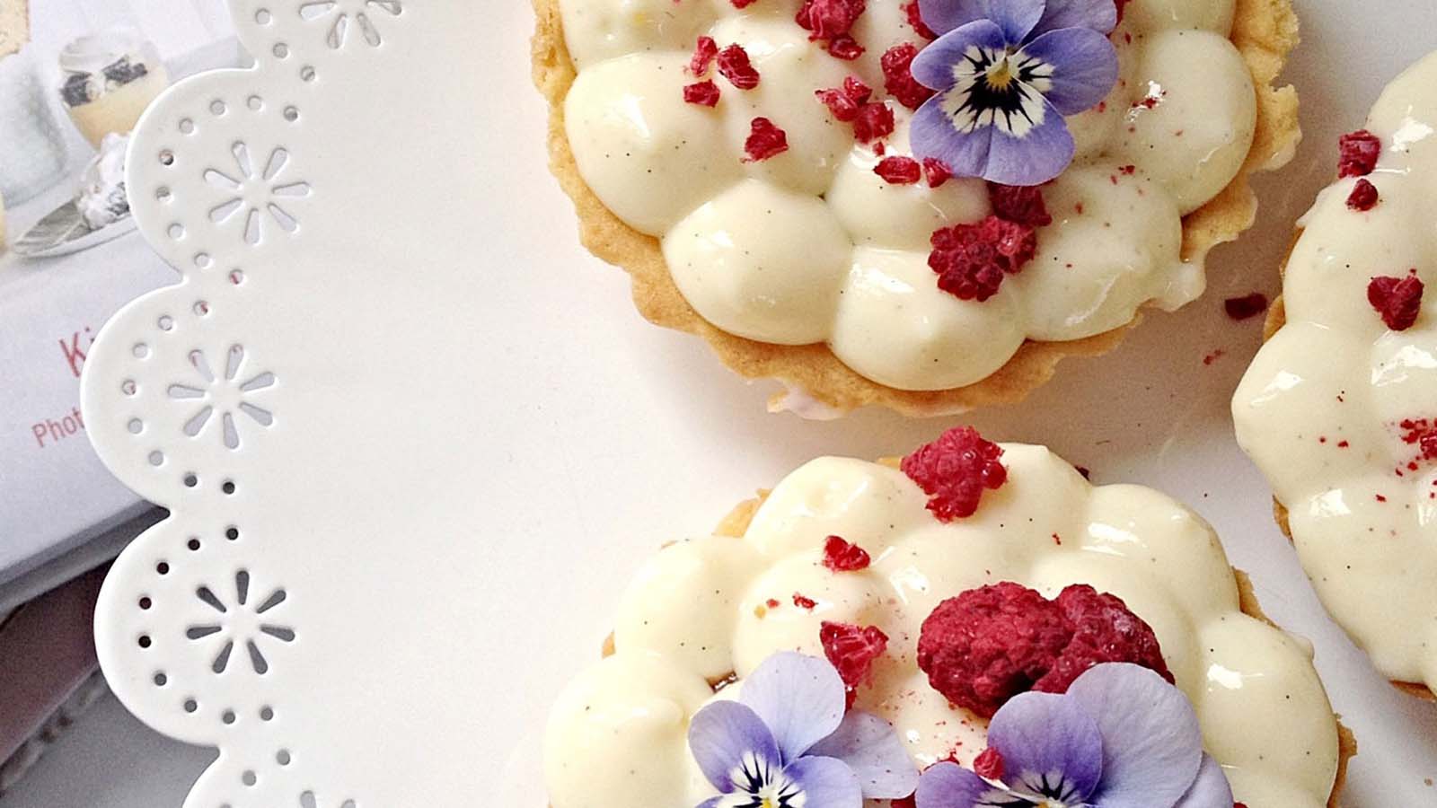 A thick, glossy pastry cream creme patissiere filling inside a bowl.