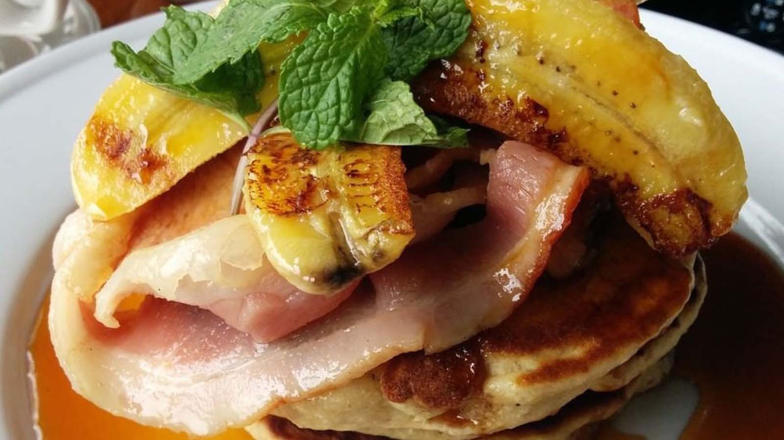 Fluffy breakfast crumpets topped with crispy bacon rashers and sweet caramelised banana slices.