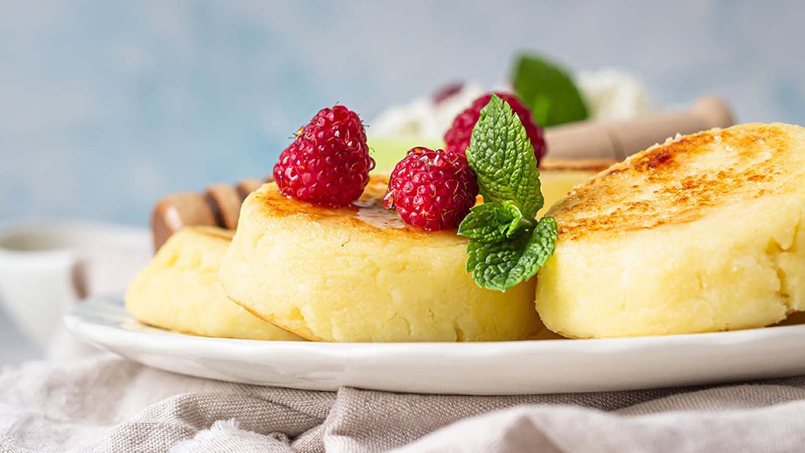 A traditional crustless South African milk tart baked custard dessert dusted with cinnamon powder.