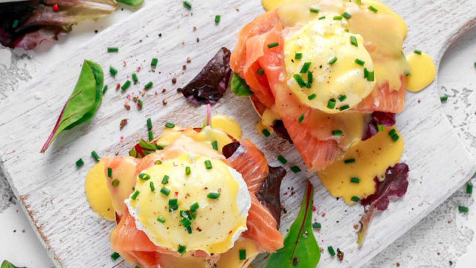 A premium eggs benedict version topped with poached eggs and luxury ribbons of smoked salmon.