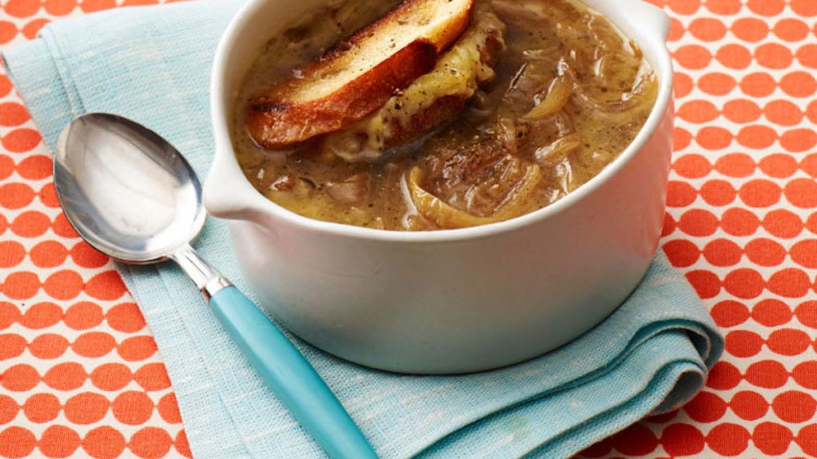 A traditional French onion soup baked with a cheese-crusted baguette top.