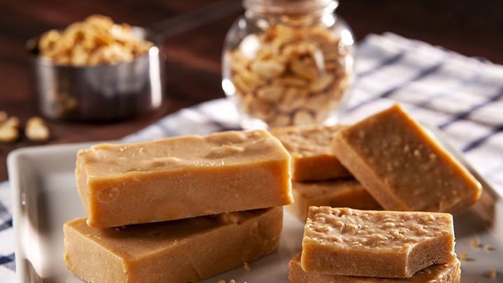 Thick blocks of smooth, sweet homemade caramel fudge neatly stacked.