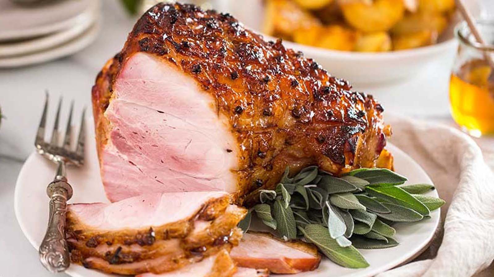 A sticky, sweet brown sugar and honey glazed ham roast perfect for a holiday feast.