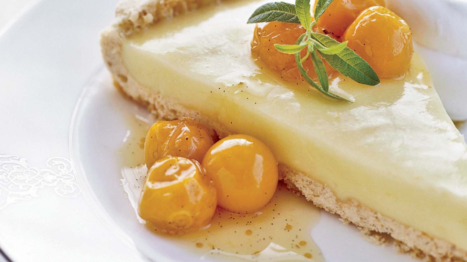 A sweet and tart baked gooseberry tart with a golden brown pastry lattice grid top.