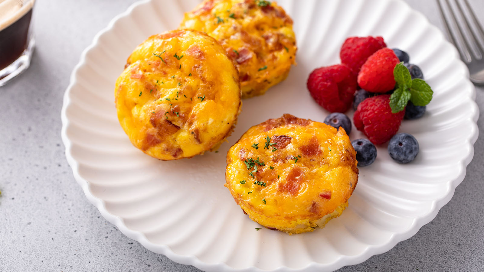 A classic simple breakfast omelette stuffed with diced ham and sharp cheddar cheese.