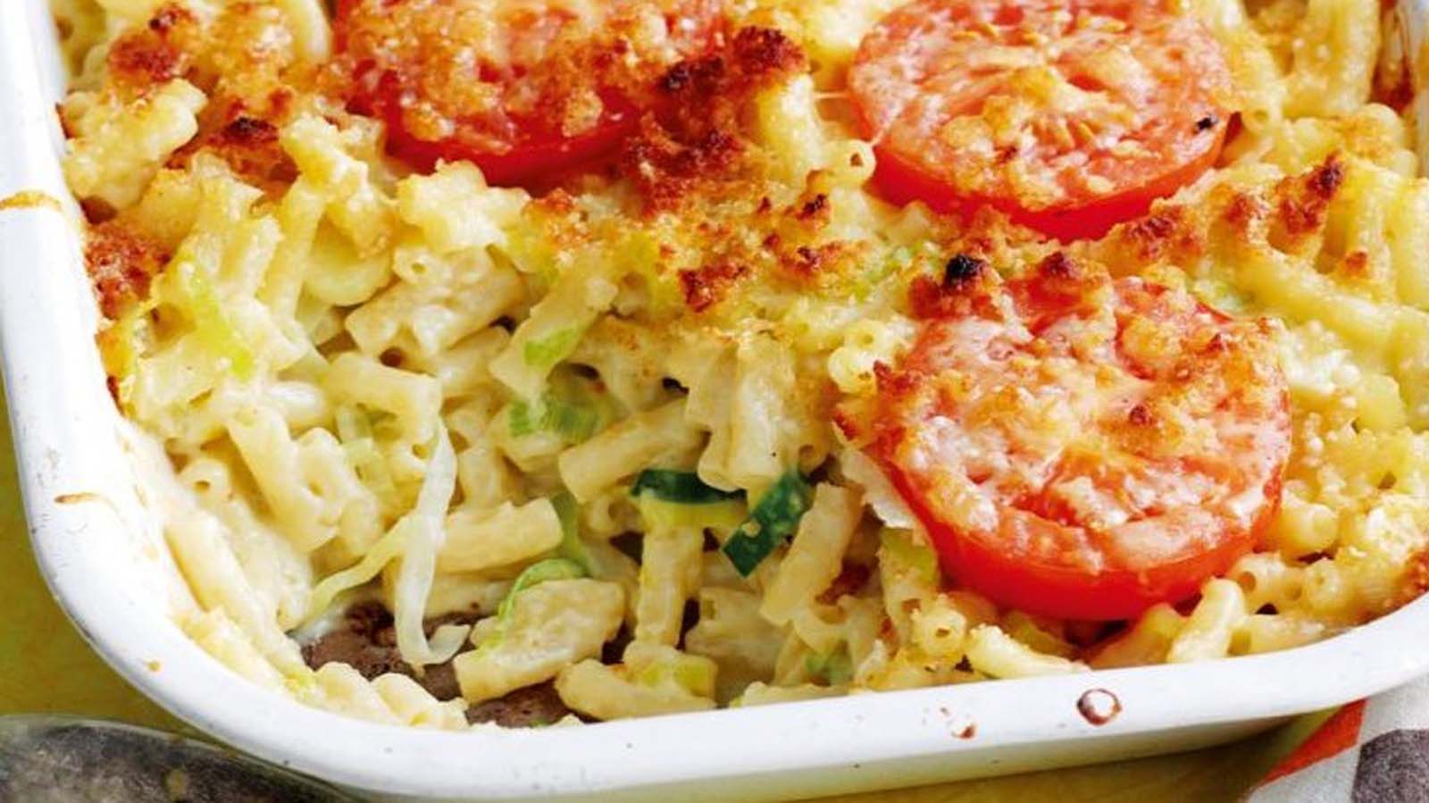 A comforting dish of baked macaroni cheese with a bubbling, golden brown crust.