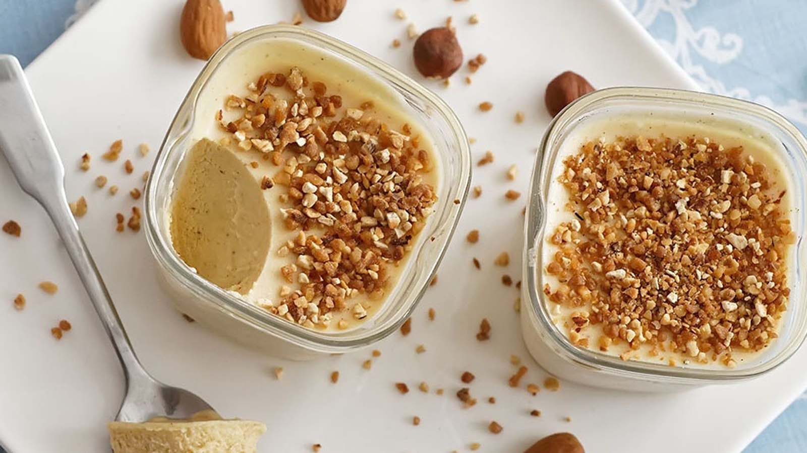 A sleek, elegant slice of cold parfait glace frozen dessert on a plate.