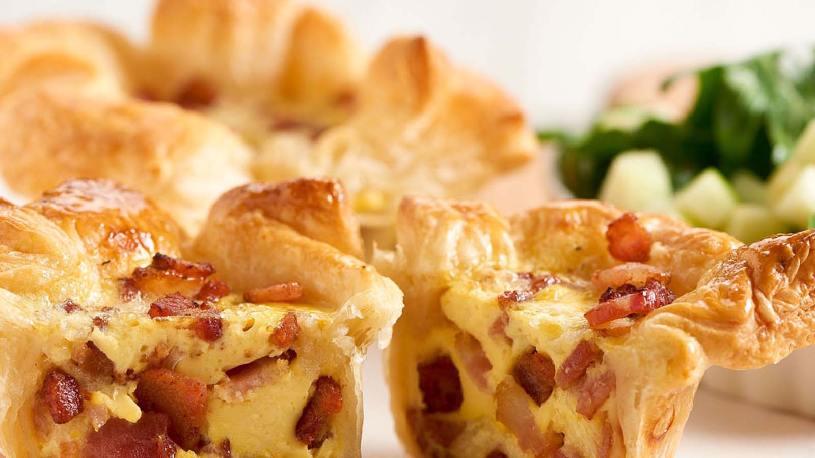 A classic French savoury Quiche Lorraine with a crisp pastry base and bacon filling.