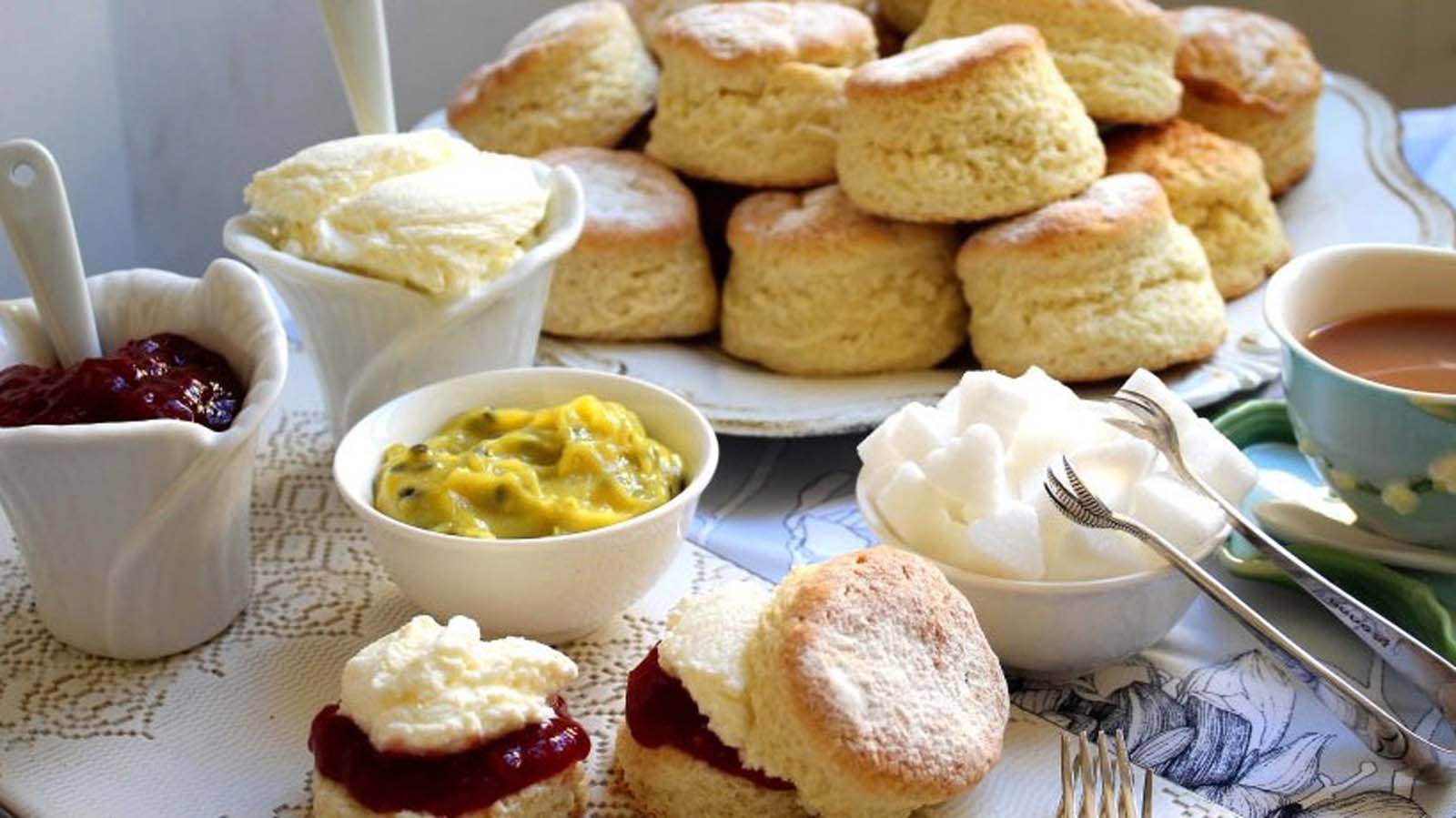 Golden brown, freshly baked buttermilk scones served with jam and dollops of cream.