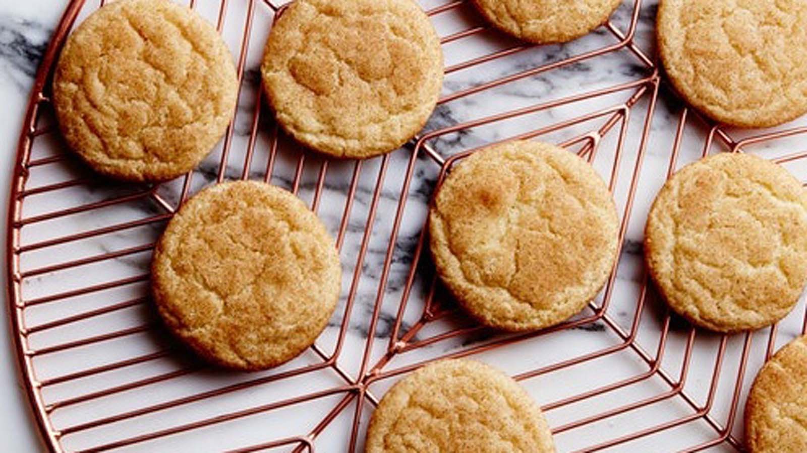 Crisp homemade snickerdoodle biscuits rolled beautifully in cinnamon sugar.