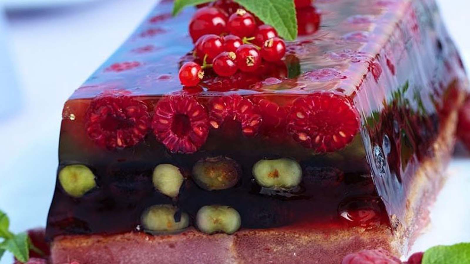 A beautiful translucent summer fruit terrine gel dessert packed with colorful berries.
