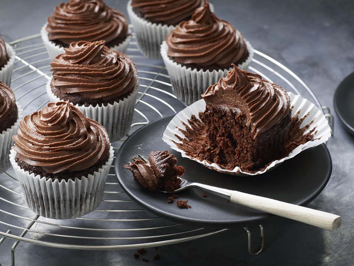 Decadent chocolate cupcakes topped with a swirl of rich chocolate buttercream frosting.