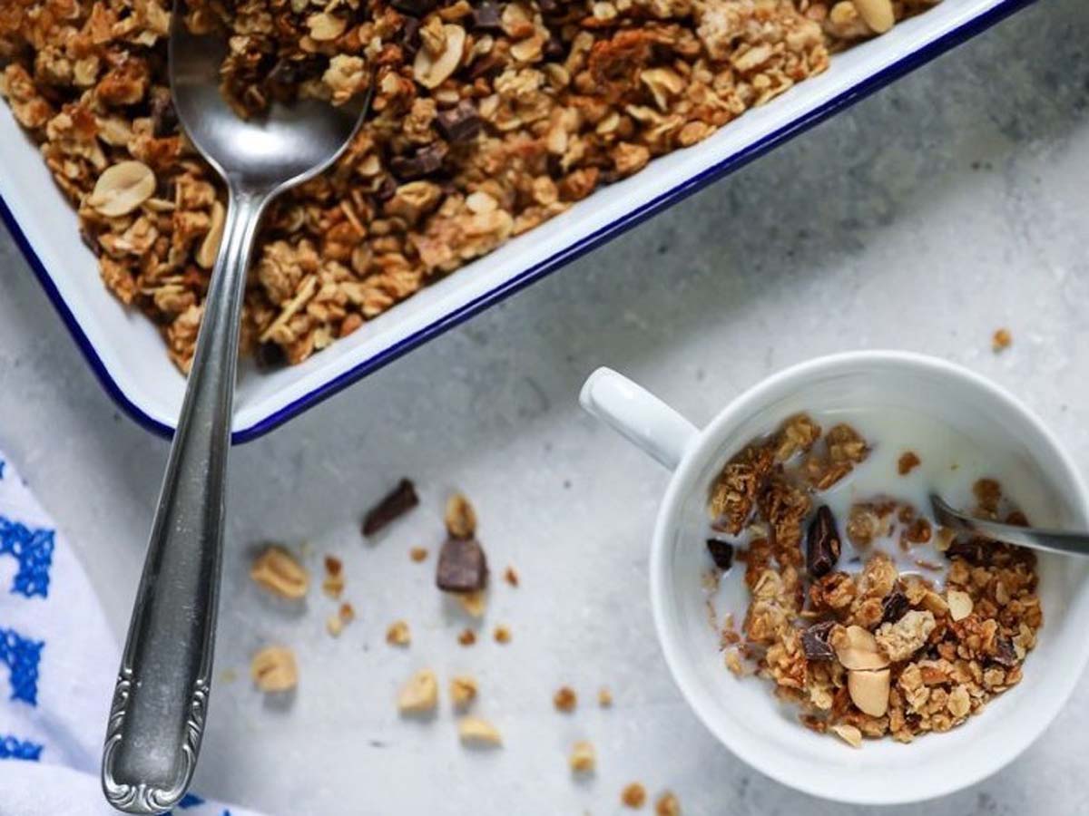 A healthy bowl of toasted breakfast muesli with nuts, seeds, and rolled oats.
