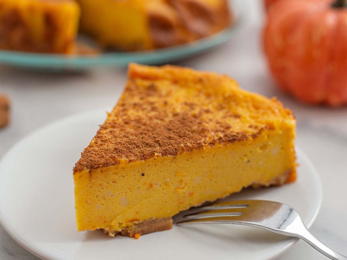 A traditional baked South African sweet pumpkin tart with a spiced cinnamon aroma.