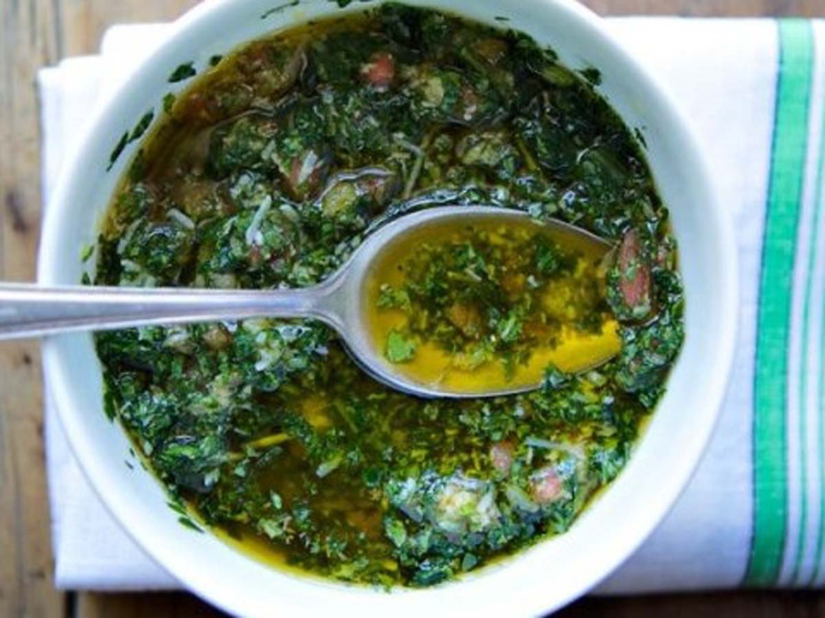 A bright green, fresh Italian salsa verde herb sauce with parsley and capers.