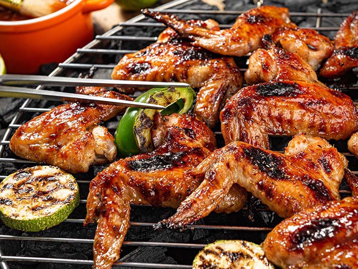 Succulent pieces of slow-smoked BBQ meat cooked to absolute perfection on a Weber grill.