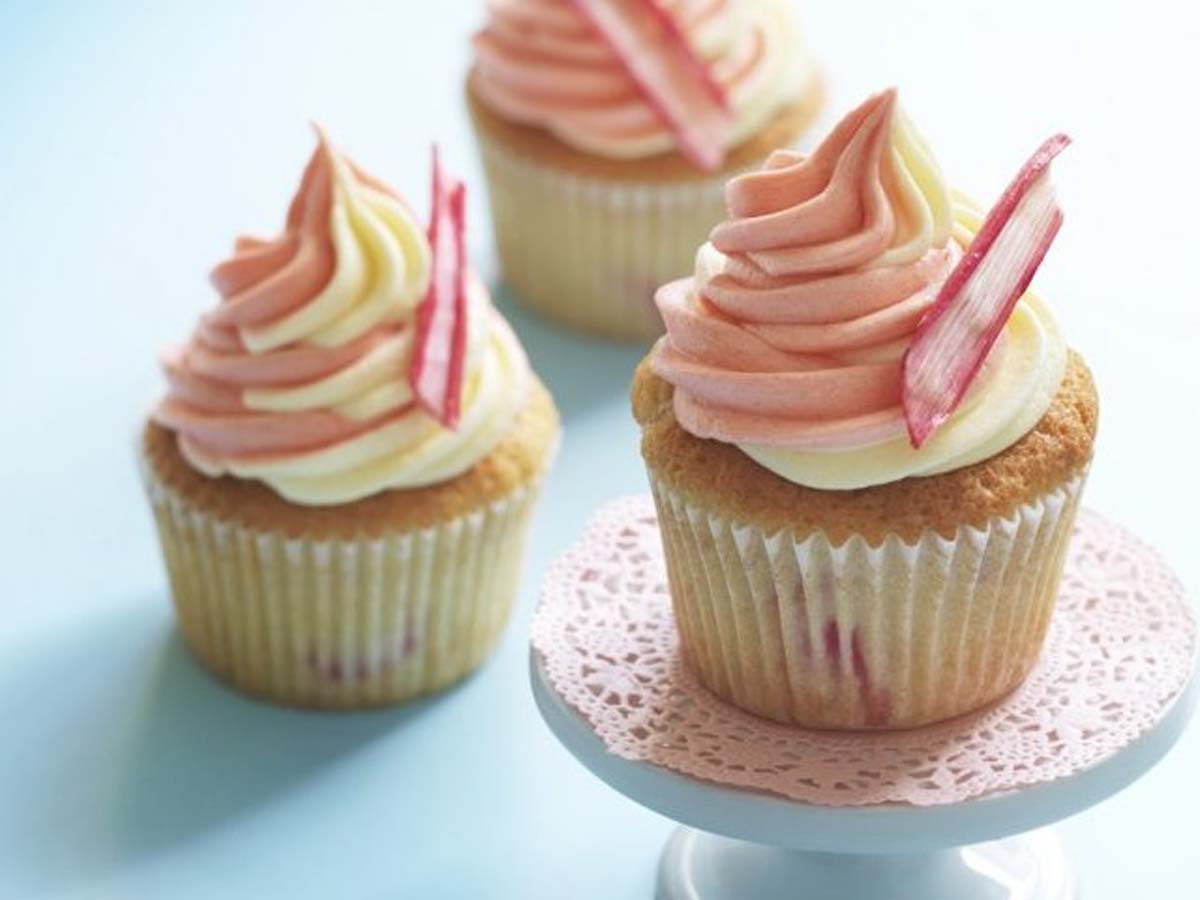 Classic vanilla cupcakes decorated with smooth vanilla buttercream frosting and sprinkles.
