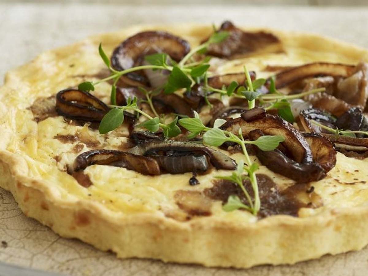 A savoury baked quiche loaded with smoky bacon pieces and sweet red onion marmalade.