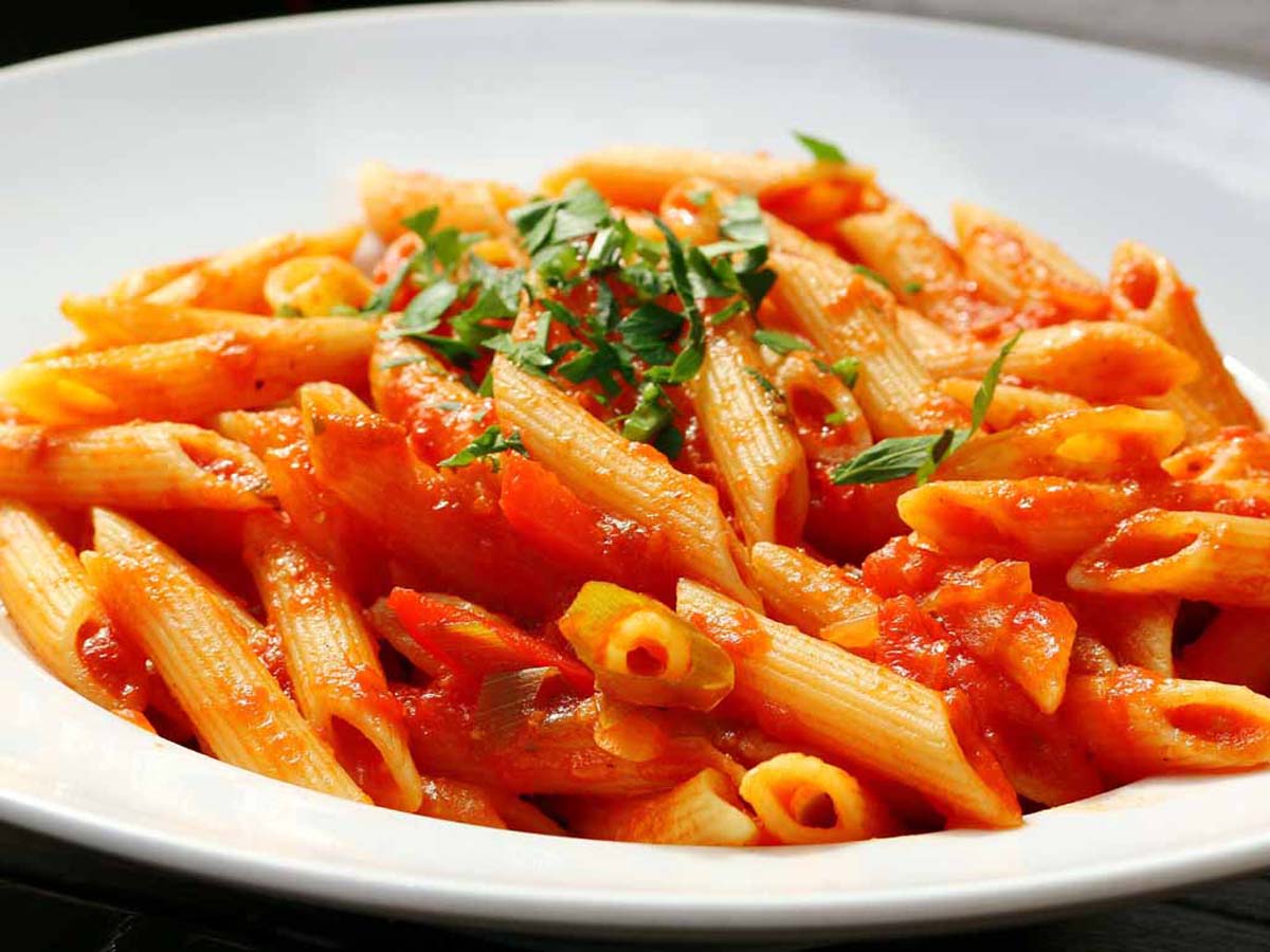 Tossed pasta with tender butternut pieces, crispy bacon, and a savoury tomato sauce.