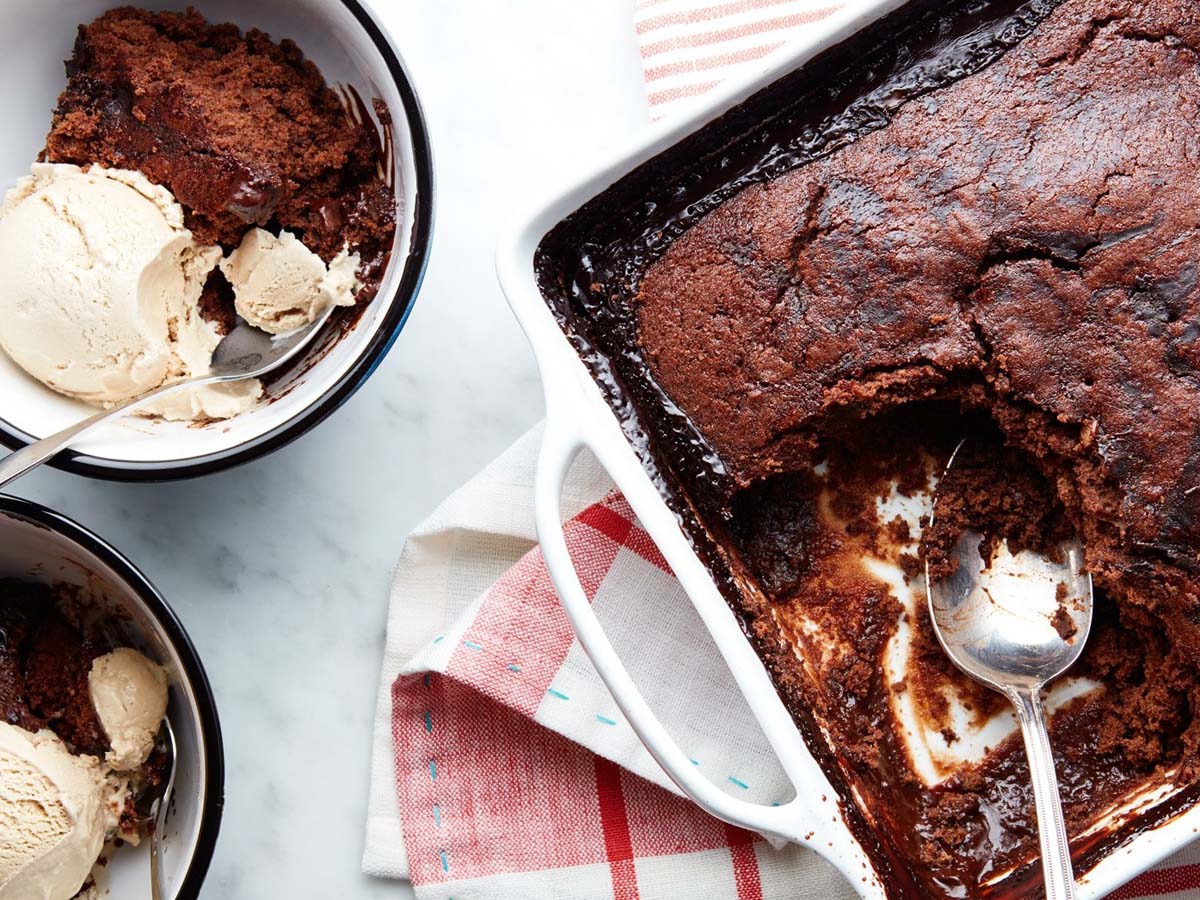 A warm baked chocolate pudding dessert dripping with hot chocolate fudge sauce.