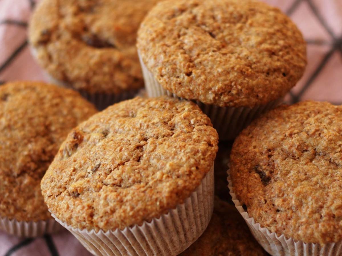 Healthy fiber-rich baked bran muffins packed with sweet raisins and chopped sweet dates.