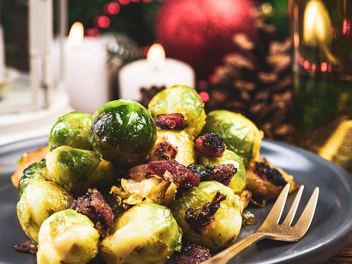 Sautéed green Brussels sprouts tossed beautifully with crispy pan-fried bacon bits.