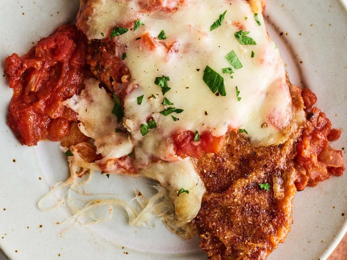 Crispy breaded chicken parmesan cutlets baked with melted mozzarella and marinara sauce.