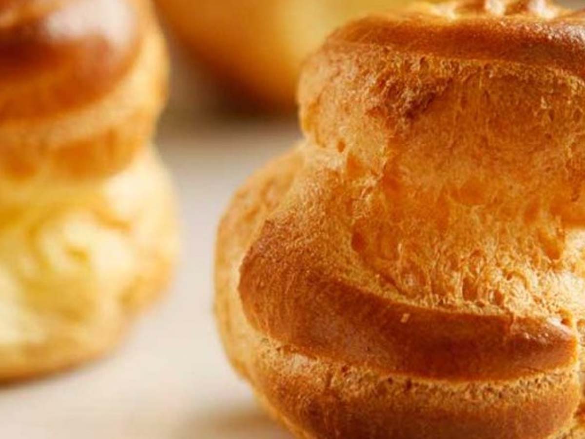 Light, hollow and crisp freshly baked choux pastry shells for profiteroles.