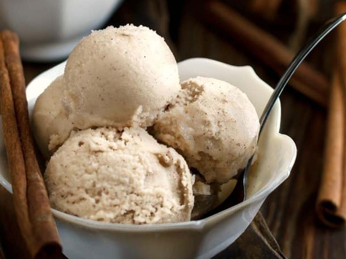 A scoop of unique, warm-spiced sweet cinnamon ice cream frozen dessert.