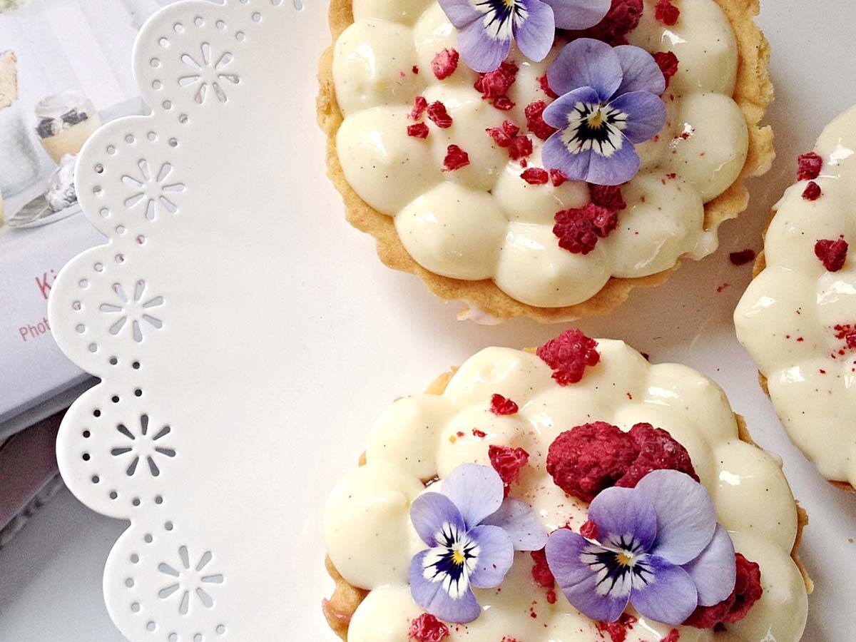 A thick, glossy pastry cream creme patissiere filling inside a bowl.