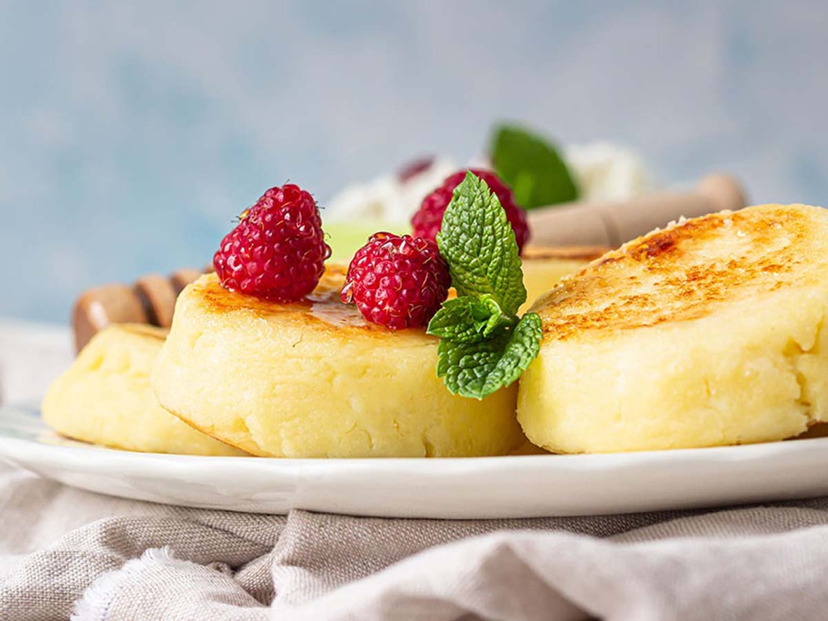 A traditional crustless South African milk tart baked custard dessert dusted with cinnamon powder.