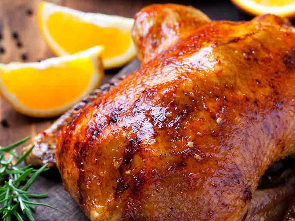 An elegant dish of French duck a l''orange roasted duck breast with sweet orange glaze.