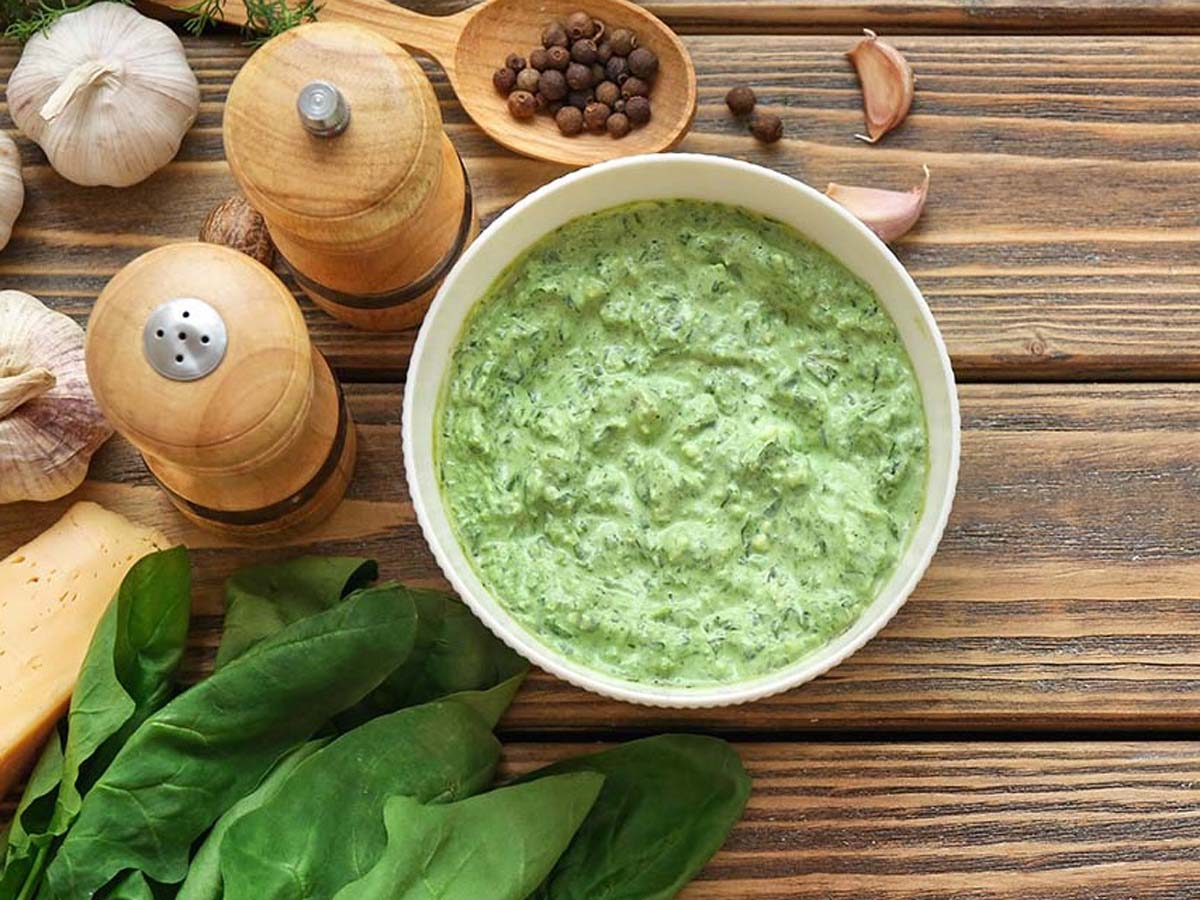 A side dish of extra rich and smooth creamy creamed spinach cooked with garlic cream.