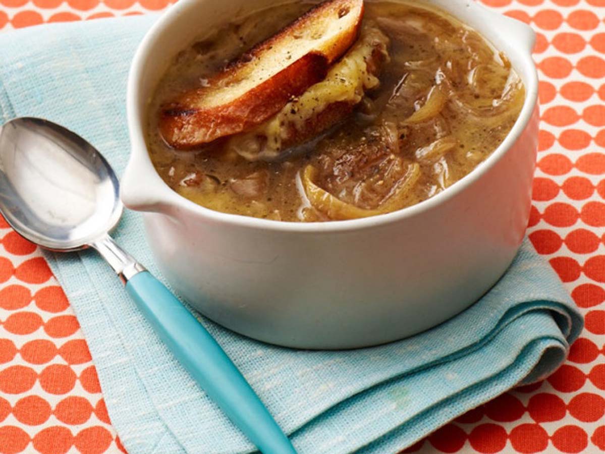A traditional French onion soup baked with a cheese-crusted baguette top.